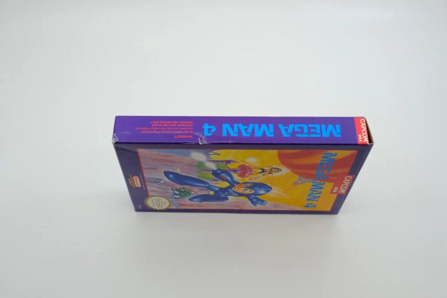 Mega Man 4 – Complete in Box RetroGate - Your Gateway to Classic Gaming