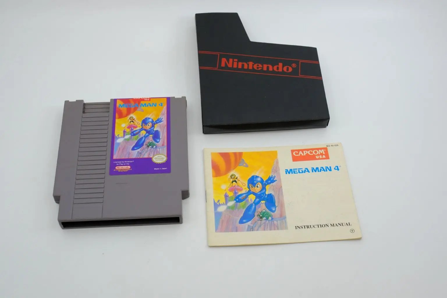 Mega Man 4 – Complete in Box RetroGate - Your Gateway to Classic Gaming